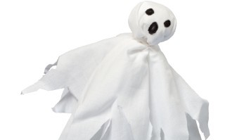 A handmade ghost floats on an isolated white background.