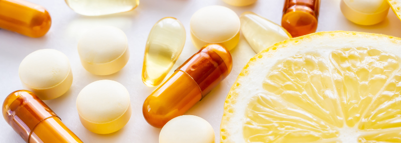Nutritional supplements and lemon to represent media coverage for nutrition products