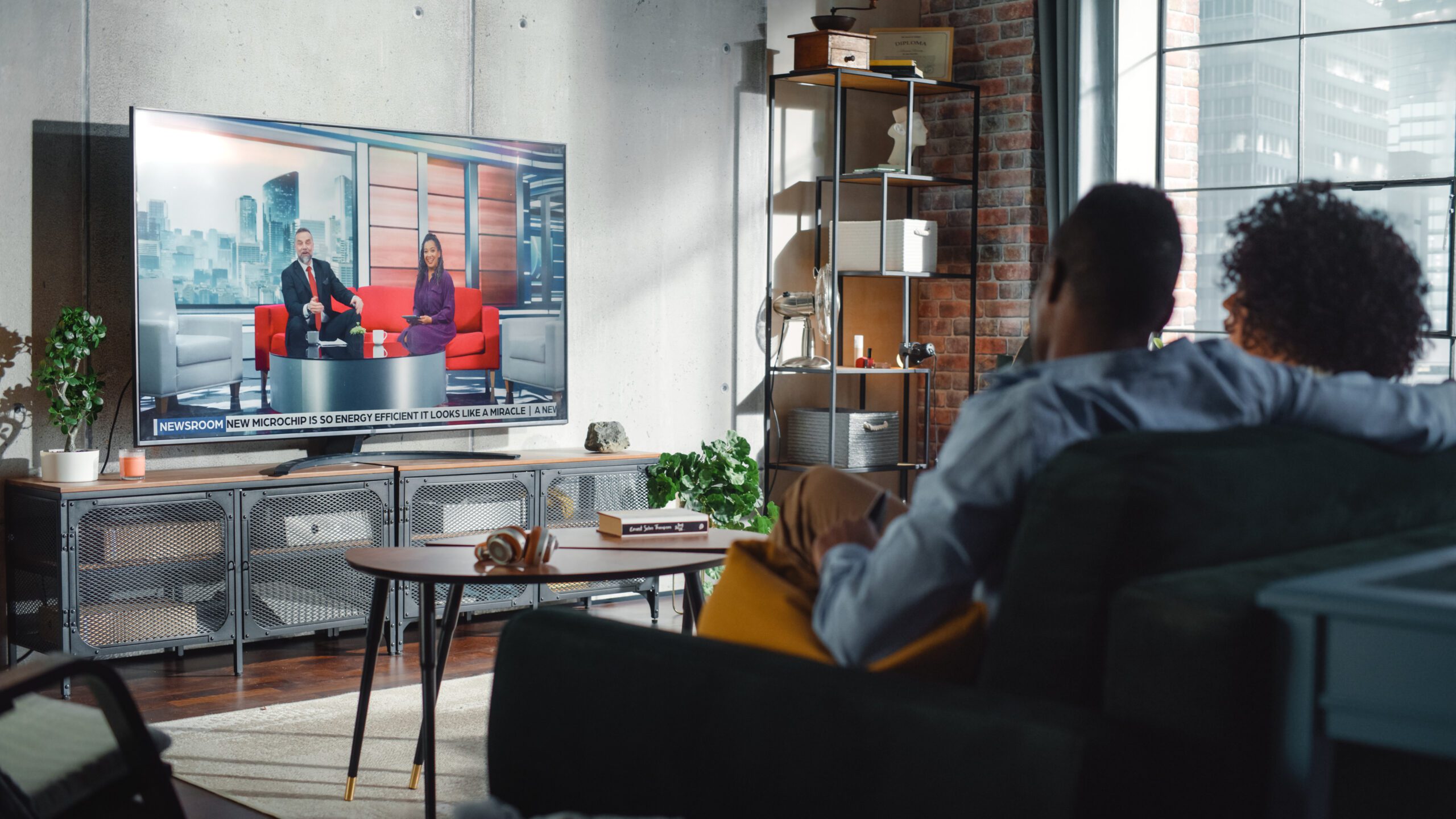 People watching news on TV
