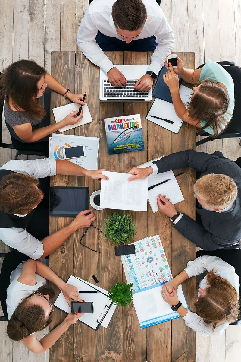 People gathered around conference table 