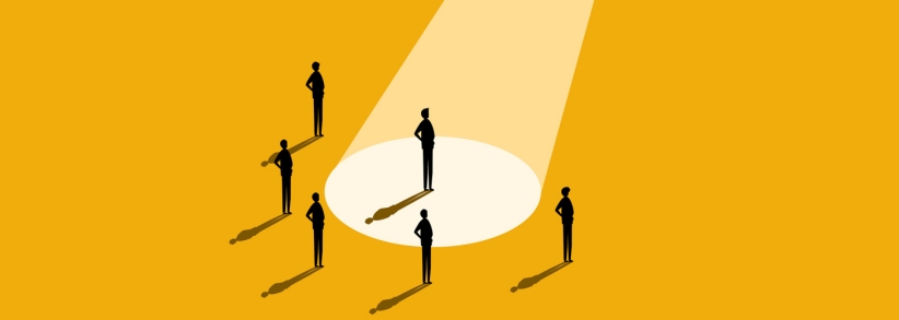 Group of people with spotlight highlighting just one