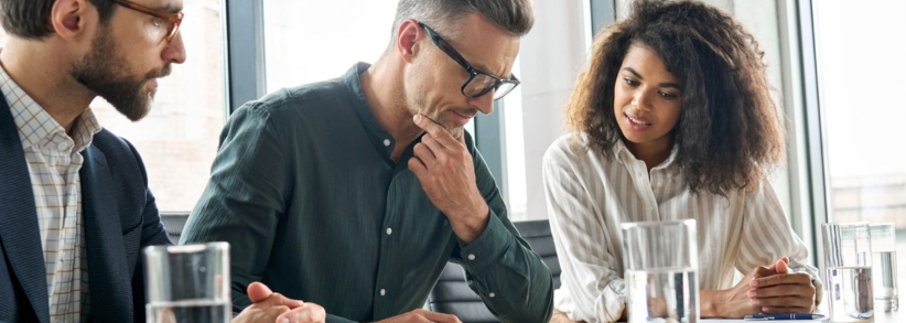 Marketing team of 3 people making decisions together